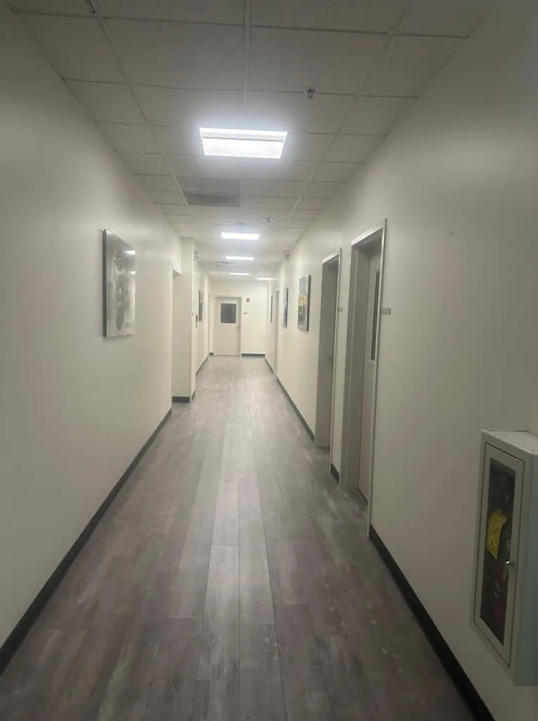 Commercial hallway with fresh white walls and new flooring